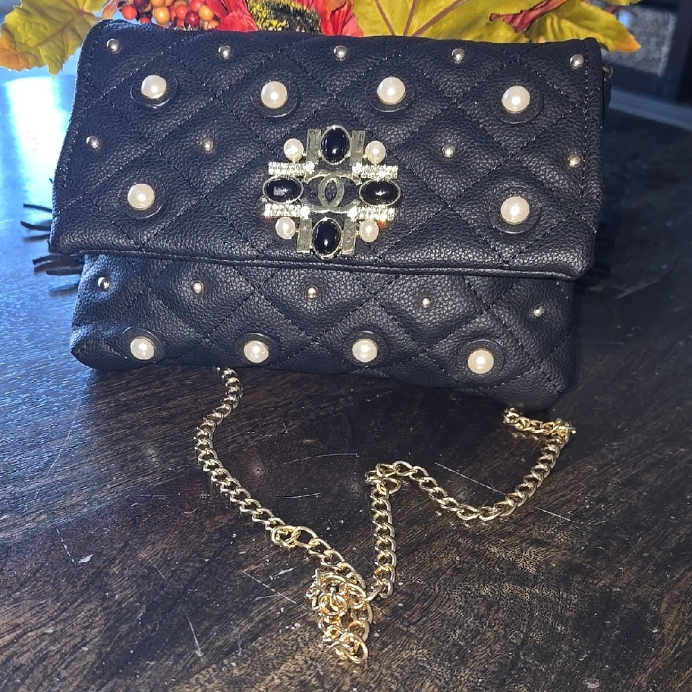 Elegant Black Quilted Women's Bag with Gold Chain And CC Logo.